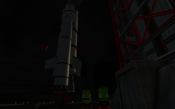 Captains Bob and Wehrtop outside the crew tower elevator with the rocket rising behind them. It's 17.8m tall